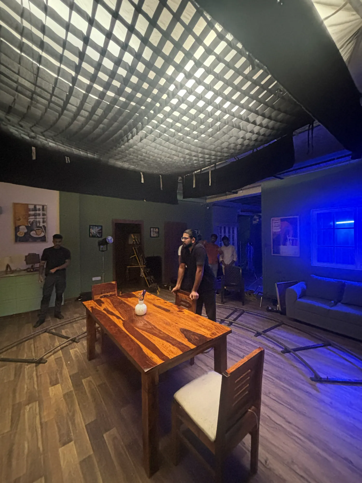 A film production set prepared around a dining table